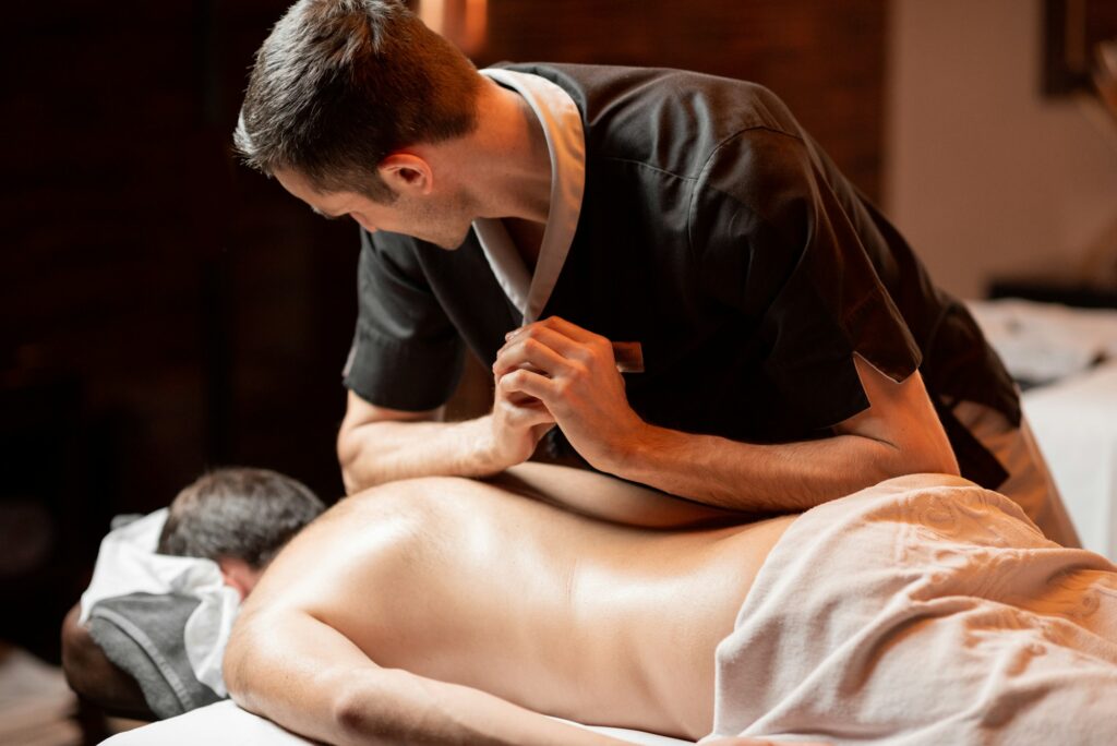 Professional deep tissue massage on a male client