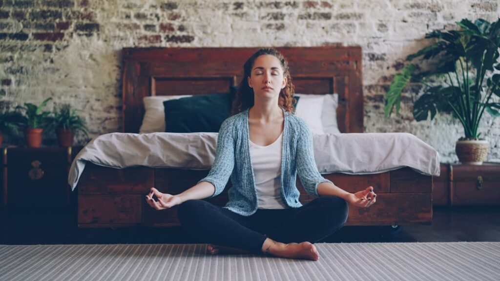 Person practicing calm breathing and relaxation for everyday stress management