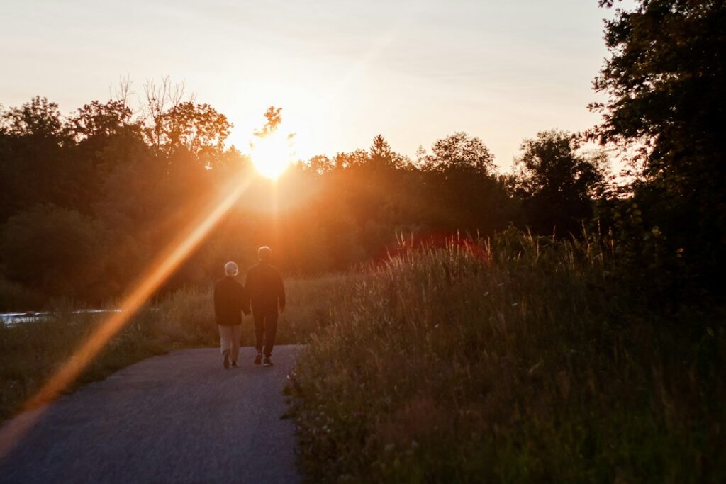 People walking outdoors in natural light for wellbeing