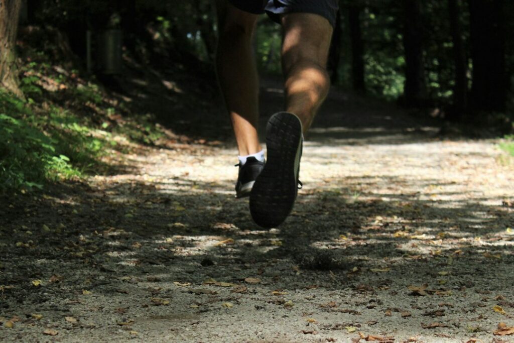 Walking shoes on a trail representing daily movement